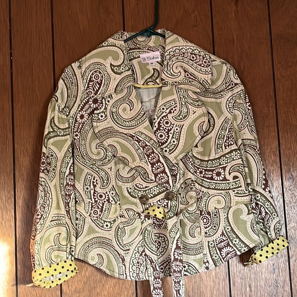 Neutral colors with brown dots on lime green background on cuffs